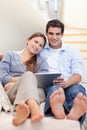 Portrait of a young couple using a tablet computer Royalty Free Stock Photo