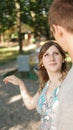 Portrait of a young couples in a summer park