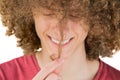 Portrait young curly european man joyfully smiling looks at his long hair. holds a curl of hair with his fingers. very lush male Royalty Free Stock Photo