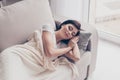 Portrait of a young cute brunette girl sleeping on the sofa in l Royalty Free Stock Photo