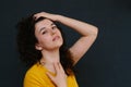 Portrait of young cute emotional caucasian female on grey background.