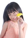 Portrait of young cute girl with yellow flower
