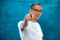 Cute man posing on blue background Royalty Free Stock Photo