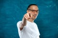 Cute man posing on blue background Royalty Free Stock Photo