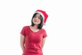 Portrait of a young cute woman wearing a Christmas Santa Claus hat isolated on white background. Royalty Free Stock Photo