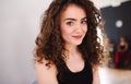 A portrait of young dance woman teacher indoors looking at camera.