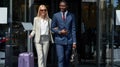 Portrait of young diverse man and woman leaving hotel