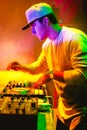 Portrait of Young DJ playing mixing music at night Royalty Free Stock Photo