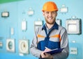Portrait of young engineer taking notes at control room Royalty Free Stock Photo