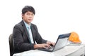 Portrait young engineering man sittin and working on laptop com Royalty Free Stock Photo