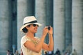 Portrait of young european black-haired girl-traveler travelling in VaticanCity Royalty Free Stock Photo