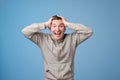 Portrait of young european man with shocked facial expression. He can not believe his luck or success. Royalty Free Stock Photo