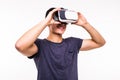 Portrait of young excited man experiencing virtual reality