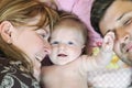 Portrait of young family with cute little babby