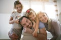 Portrait of young family at home.