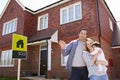 Portrait Of Young Family With Keys To New Home Royalty Free Stock Photo