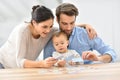 Portrait of young family playing cards Royalty Free Stock Photo