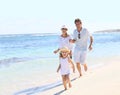 Portrait of a young family spending time together on the seaside Royalty Free Stock Photo