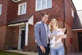 Portrait Of Young Family Standing Outside New Home Royalty Free Stock Photo
