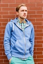 Portrait of young fashion man in casual wear and wooden bowtie