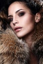 Portrait of a young fashion model wearing fur
