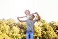 Portrait of young father carrying his daughter on his back Royalty Free Stock Photo