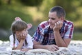 Portrait of young father and cute blond girl with long braids la Royalty Free Stock Photo