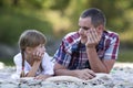 Portrait of young father and cute blond girl with long braids la Royalty Free Stock Photo