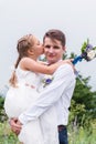 Portrait of a young father with his daughter in his arms Royalty Free Stock Photo