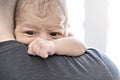 A Portrait of young father holding his newborn baby from the back Royalty Free Stock Photo