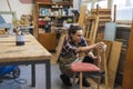 Female carpenter working in her workshop Royalty Free Stock Photo