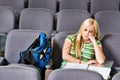 Portrait of Young female college student sleeping in lecture room Royalty Free Stock Photo