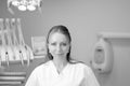 Portrait of a young female dentist in uniform