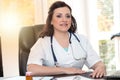 Portrait of young female doctor, light effect