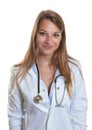 Portrait of a young female doctor on white background Royalty Free Stock Photo