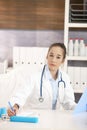 Young female doctor working at desk Royalty Free Stock Photo