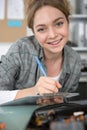 portrait young female engineer writing on clipboard Royalty Free Stock Photo