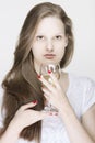 Portrait of young female model holding a glass of drink Royalty Free Stock Photo