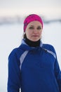 Portrait of a young female sportswoman in winter ice river