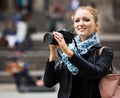 Young female traveller with camera Royalty Free Stock Photo