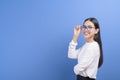 Portrait of young female wearing glasses over blue background studio  healthcare concept Royalty Free Stock Photo