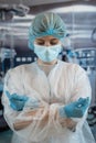 Portrait of young female woman surgeon wearing protective cloth surgical mask in operation room Royalty Free Stock Photo