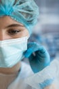 Portrait of young female woman surgeon wearing protective cloth surgical mask in operation room Royalty Free Stock Photo