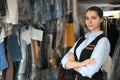 Portrait of young female worker in dry-cleaning