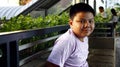 Young Filipino boy pose for the camera while at a business district Royalty Free Stock Photo