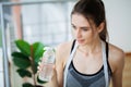 Portrait young fit woman drinking water during traning in the gym. Royalty Free Stock Photo