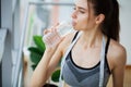 Portrait young fit woman drinking water during traning in the gym. Royalty Free Stock Photo