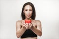 Portrait of young fit woman holding bell pepper Royalty Free Stock Photo
