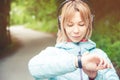 Portrait Young fitness woman looking at her smart watch while taking a break from sports training. Sportswoman checking Royalty Free Stock Photo