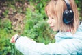 Portrait Young fitness woman looking at her smart watch while taking a break from sports training. Sportswoman checking Royalty Free Stock Photo